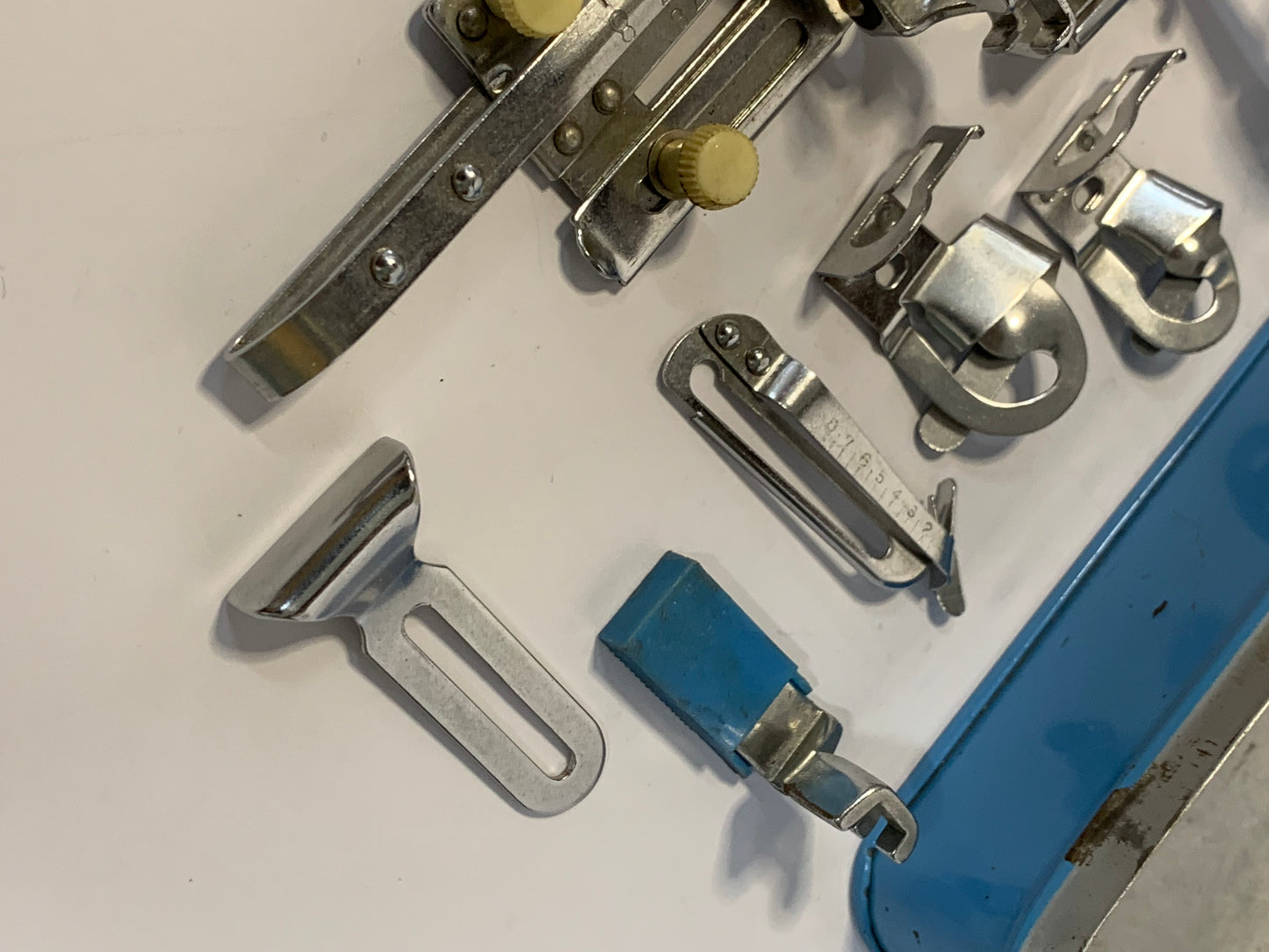 Vintage Sewing Machine Attachments Tin with attachments