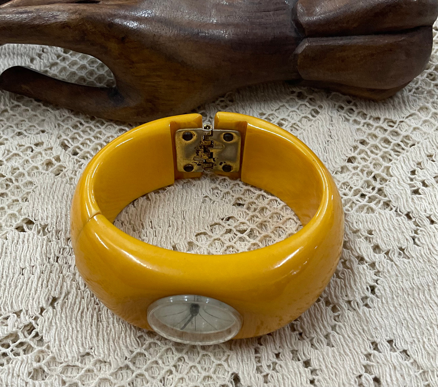 Vintage Royal Dynasty Bakelite butterscotch yellow cuff bangle watch featuring a bold mid-century modern design