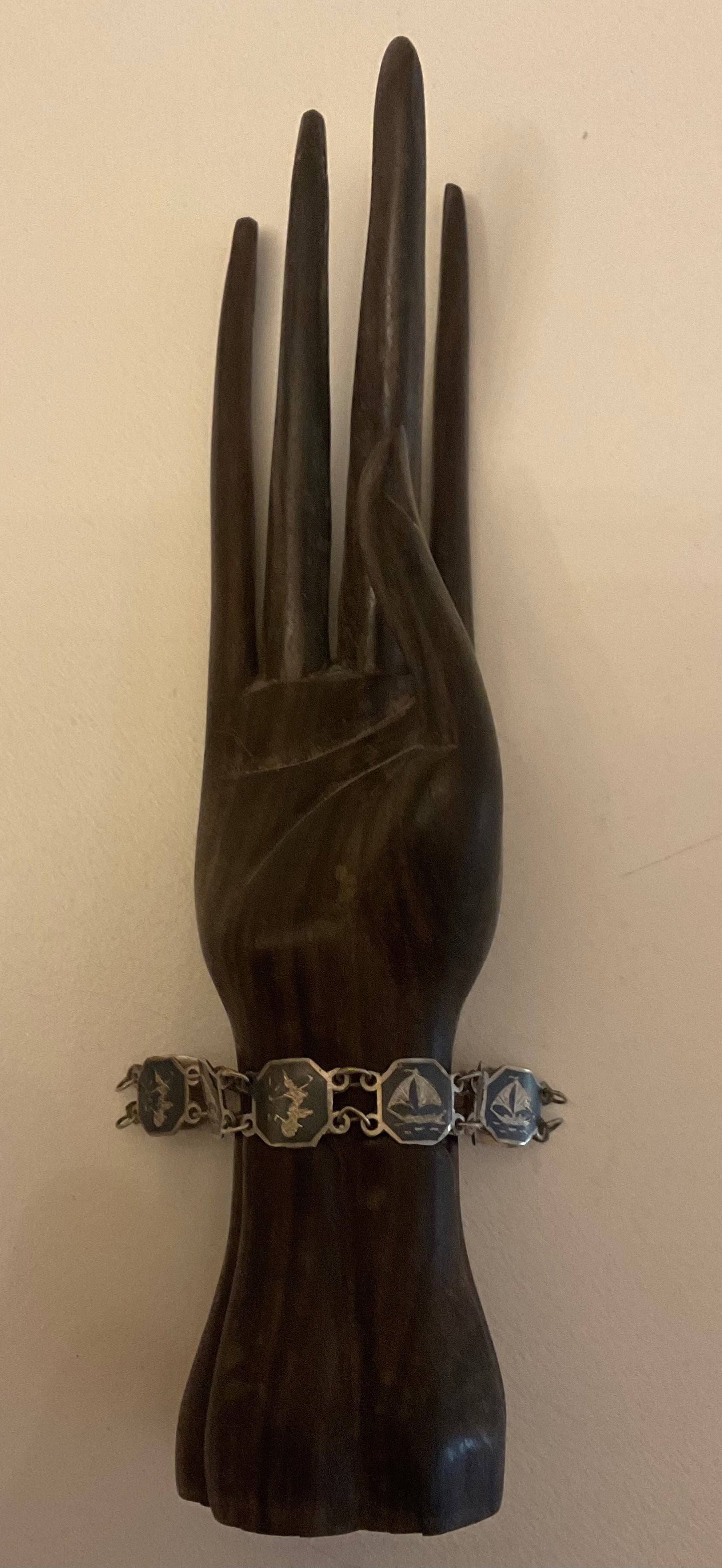 Vintage Siam Sterling silver bracelet featuring linked panels with traditional Niello enamel work.