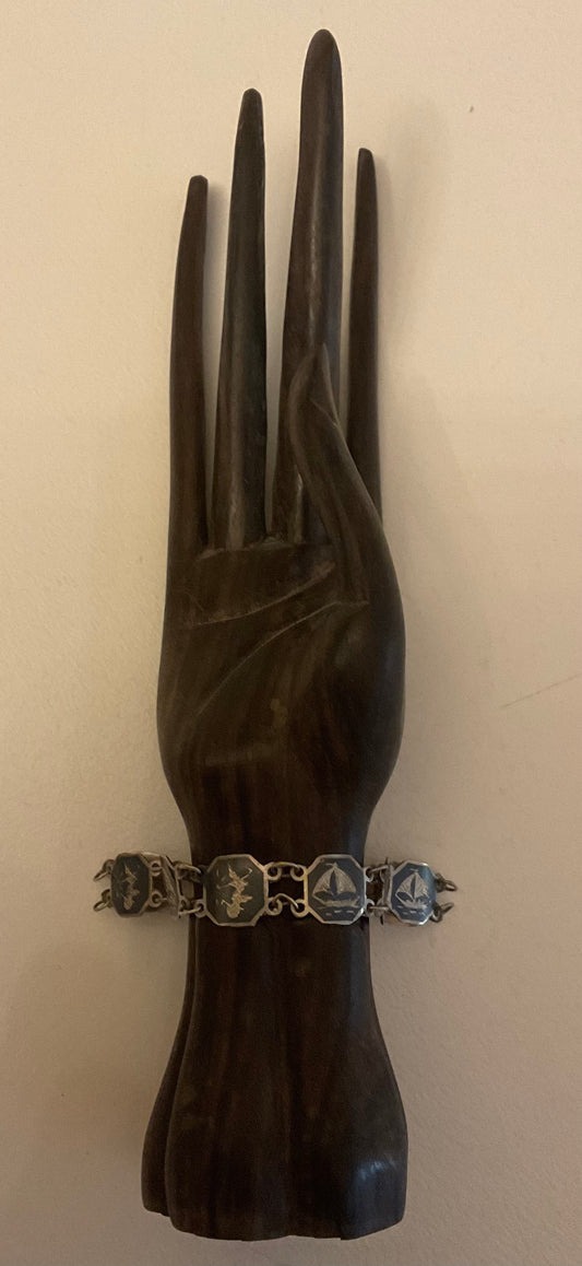 Vintage Siam Sterling silver bracelet featuring linked panels with traditional Niello enamel work.