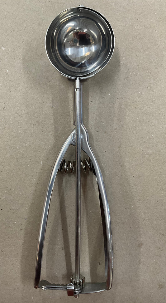 Vintage stainless steel ice cream scoop with spring-loaded handle and scraper mechanism