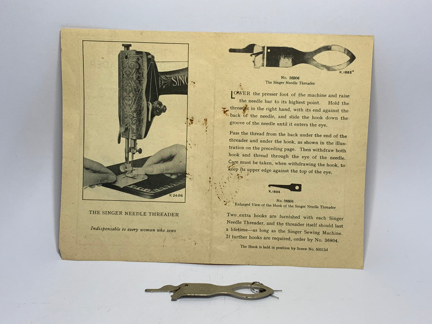 Vintage Singer Needle Threader No. 36806 with original packaging and documentation