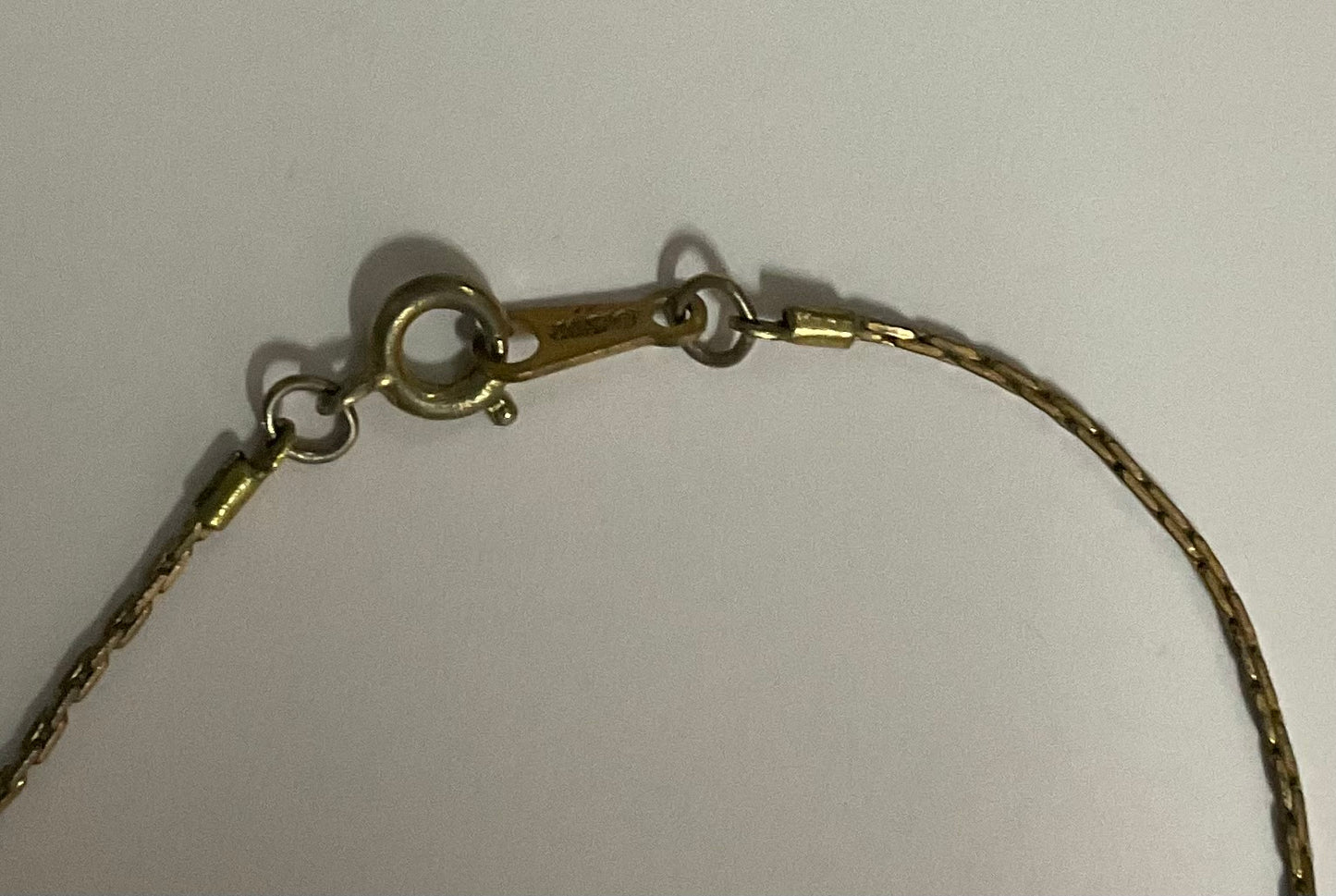 Vintage Avon necklace with a gold-tone chain and an open heart pendant.