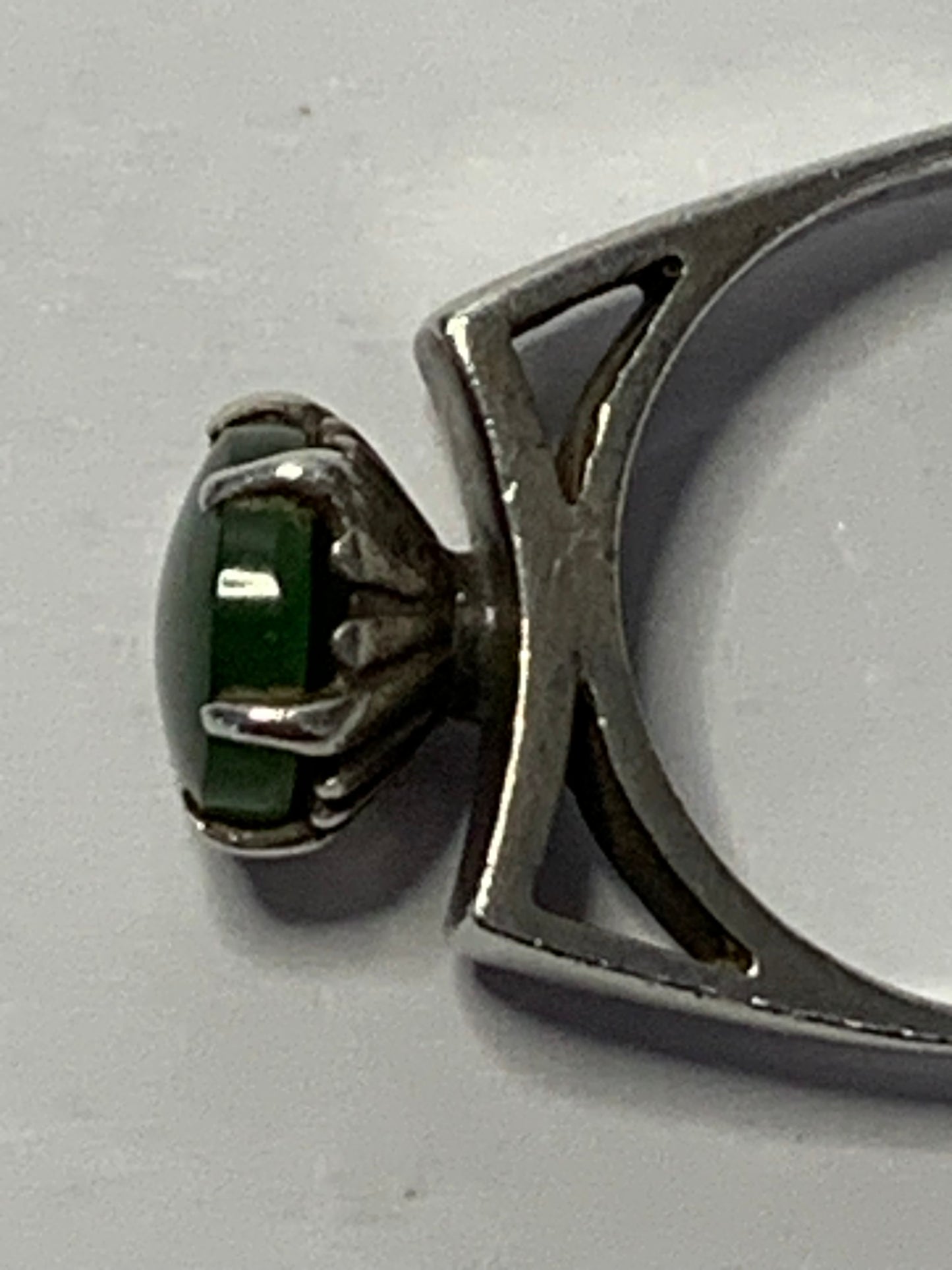 Vintage Sterling Silver Ring featuring an oval cabochon green stone (likely jade or aventurine) in a six-prong setting