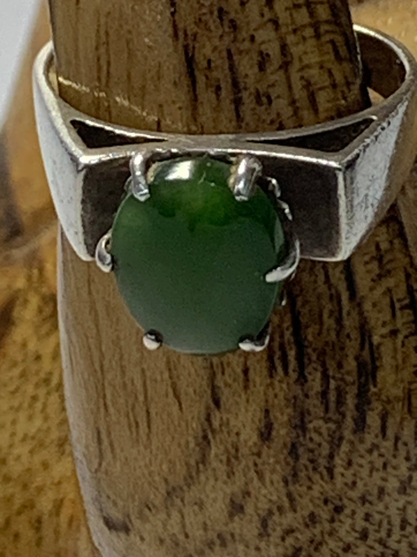 Vintage Sterling Silver Ring featuring an oval cabochon green stone (likely jade or aventurine) in a six-prong setting