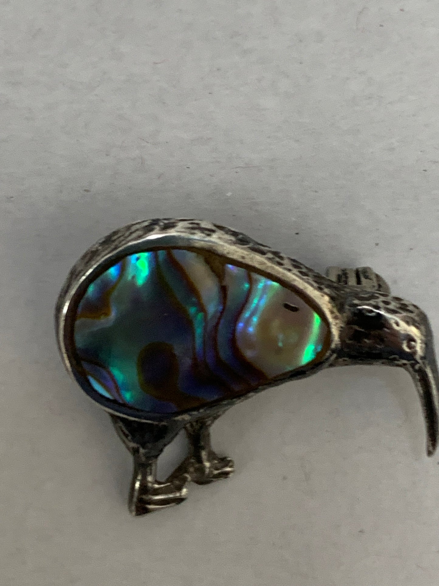 Vintage silver kiwi bird brooch with paua shell (abalone) inlay, likely from New Zealand, dating from approximately the 1960s-1980s.