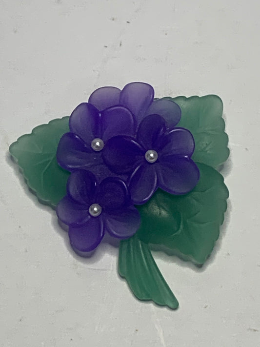 Vintage carved lucite African violet brooch from the 1980s-1990s featuring a charming floral spray design