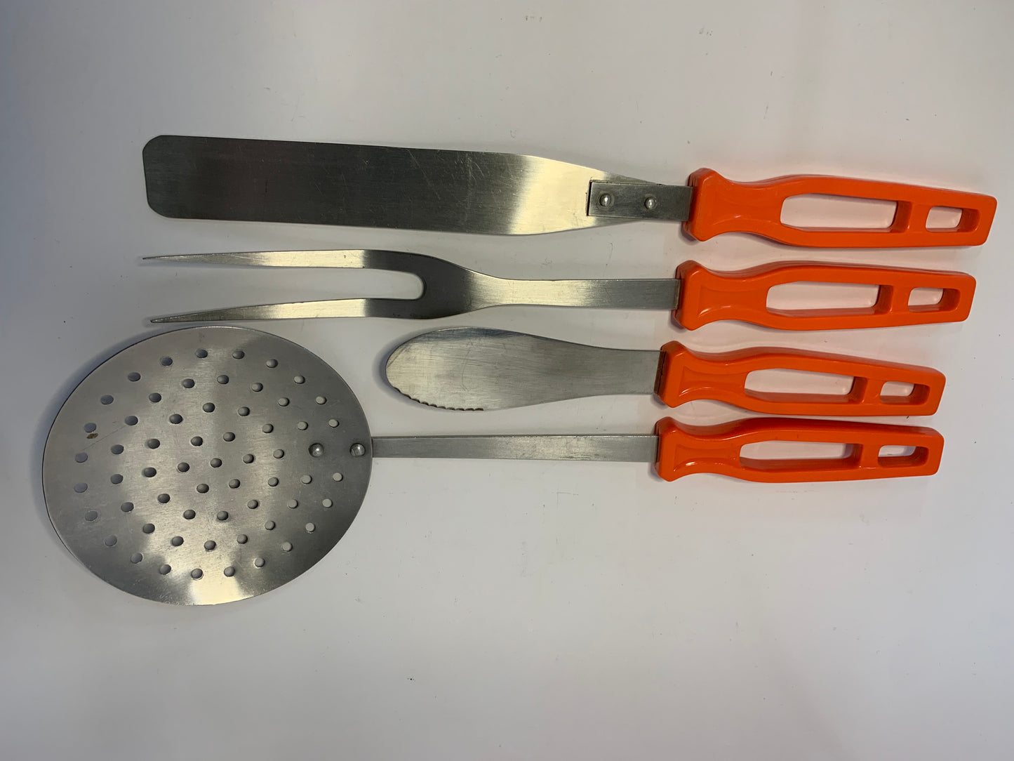 Vintage Kitchen Utensil Set with bright orange handles