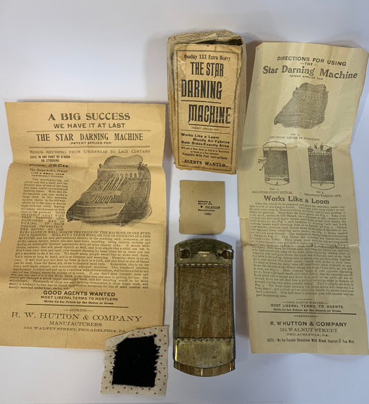 Antique Star Darning Machine set with original packaging and documentation
