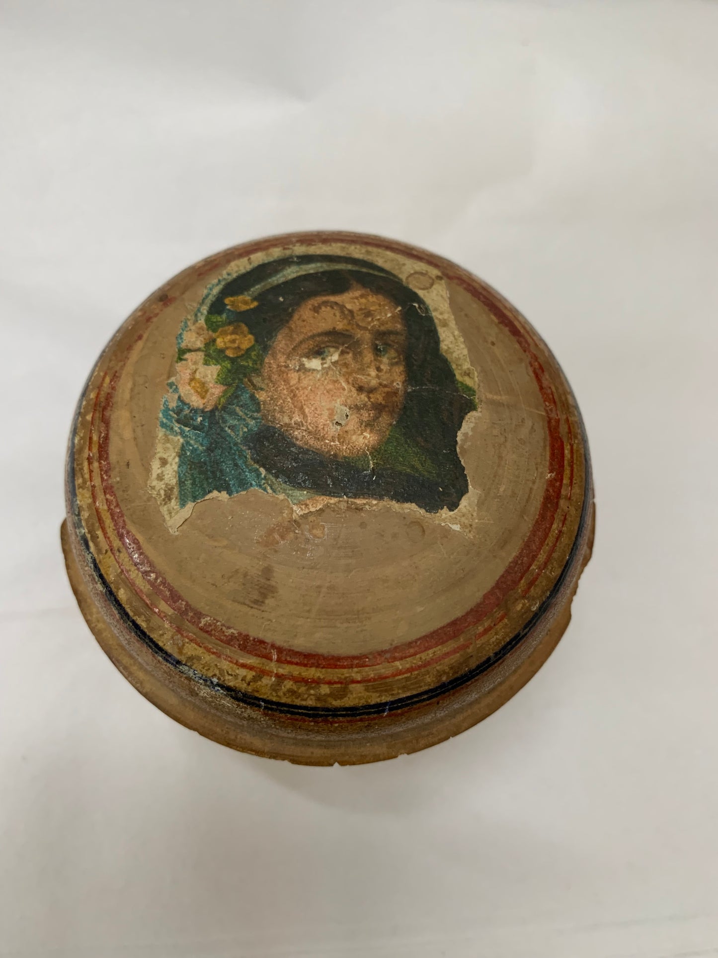 Antique turned wooden box with a painted religious icon on the lid, likely from the 19th or early 20th century.