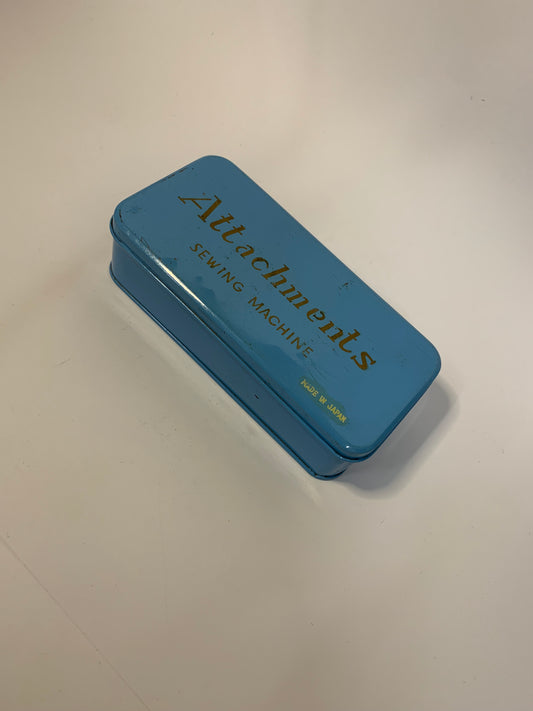 Vintage Sewing Machine Attachments Tin with attachments