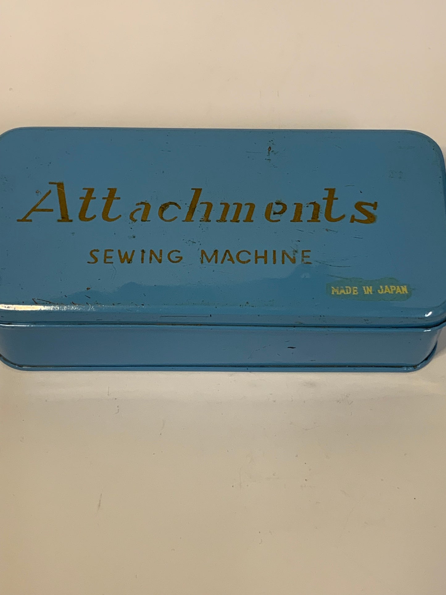 Vintage Sewing Machine Attachments Tin with attachments