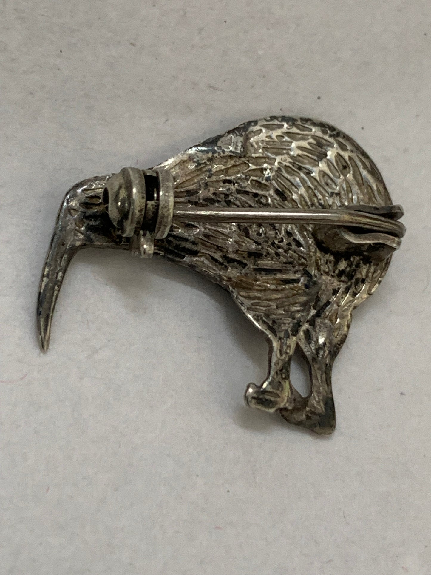 Vintage silver kiwi bird brooch with paua shell (abalone) inlay, likely from New Zealand, dating from approximately the 1960s-1980s.