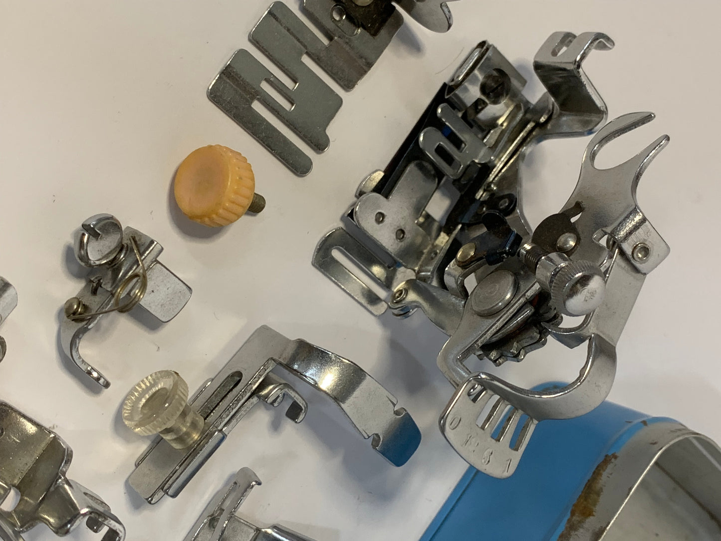 Vintage Sewing Machine Attachments Tin with attachments