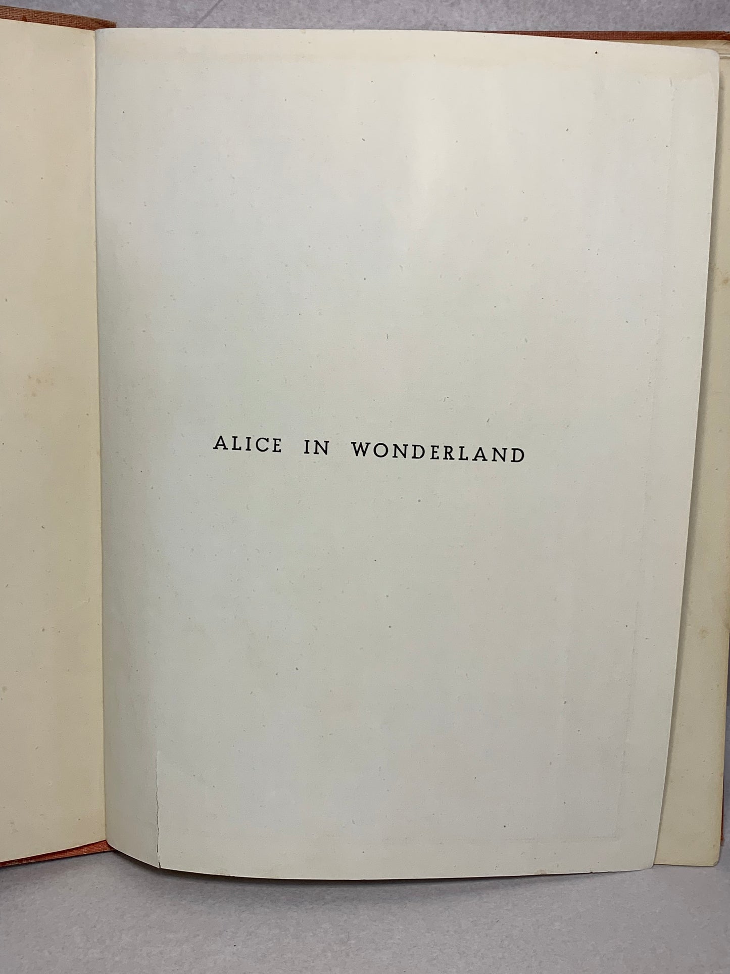 1944 first edition (thus) of Alice’s Adventures in Wonderland by Lewis Carroll, illustrated in colour by A. Rado, published by Newman Wolsey Limited, London and Leicester