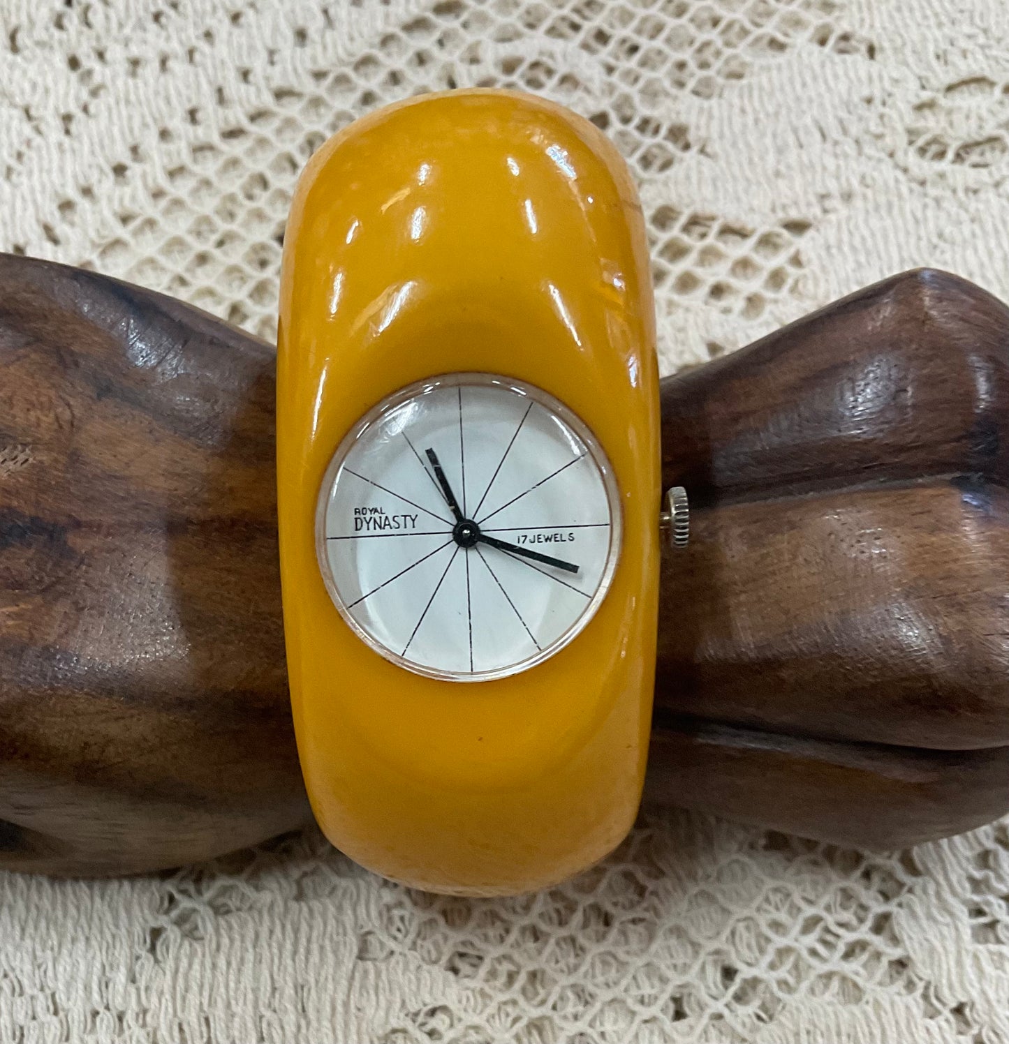 Vintage Royal Dynasty Bakelite butterscotch yellow cuff bangle watch featuring a bold mid-century modern design